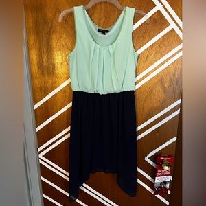 Two toned dress with Tiffany green and navy. High-low skirt and waist cinch.